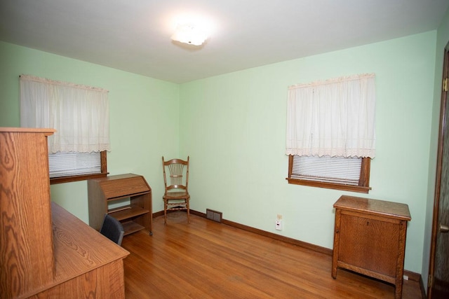 1705 California Ave E, Saint Paul, MN 55106 - home office featuring wood finished floors and baseboards