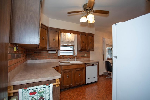 1705 California Ave E, Saint Paul, MN 55106 - kitchen featuring white appliances, backsplash, ceiling fan, and brown cabinetry