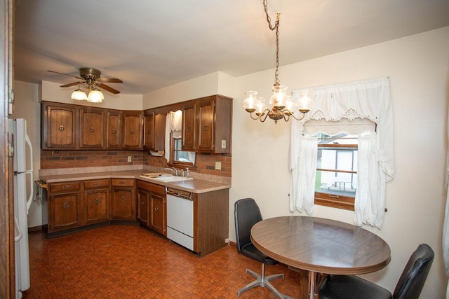 1705 California Ave E, Saint Paul, MN 55106 - kitchen featuring white appliances, a chandelier, brown cabinets, light countertops, and ceiling fan