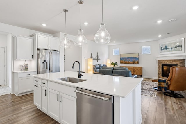15101 Quince St NW, Andover, MN 55304 - kitchen with stainless steel appliances, open floor plan, light countertops, and recessed lighting