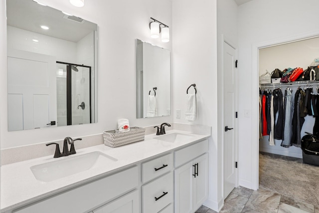15101 Quince St NW, Andover, MN 55304 - bathroom with double vanity, a shower stall, a walk in closet, and marble finish floors