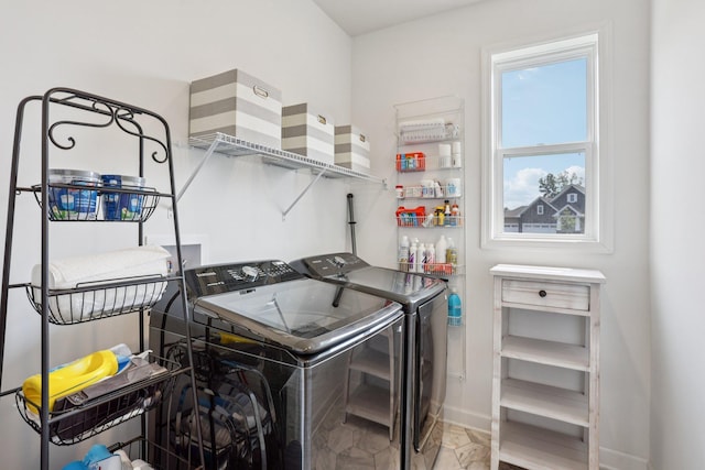 15101 Quince St NW, Andover, MN 55304 - laundry area with separate washer and dryer and marble finish floors