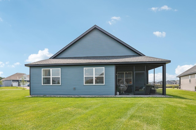 15101 Quince St NW, Andover, MN 55304 - back of property with a lawn, a sunroom, and a shingled roof