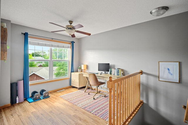 1358 Phalen Blvd, Saint Paul, MN 55106 - office space featuring a ceiling fan, wood finished floors, and a textured ceiling