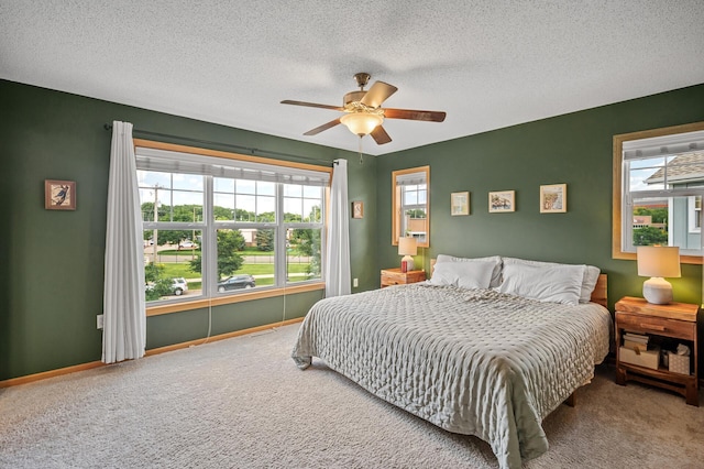 1358 Phalen Blvd, Saint Paul, MN 55106 - bedroom with carpet floors, a textured ceiling, and a ceiling fan
