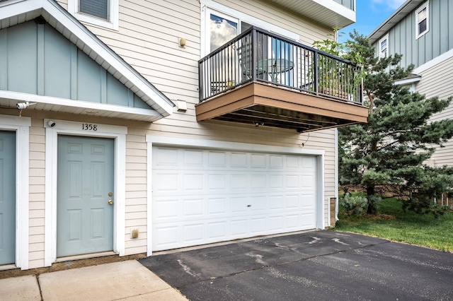 1358 Phalen Blvd, Saint Paul, MN 55106 - garage featuring asphalt driveway