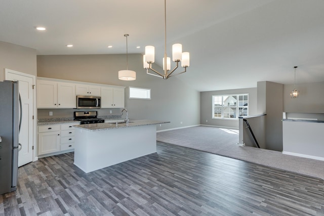 625 47th Ave NE, Saint Cloud, MN 56304 - kitchen featuring appliances with stainless steel finishes, open floor plan, plenty of natural light, light stone countertops, and high vaulted ceiling
