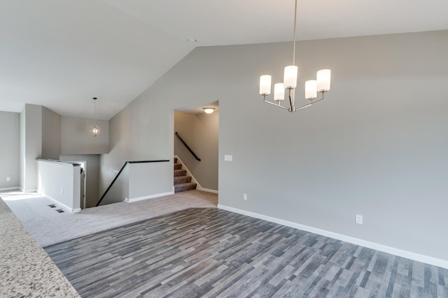 625 47th Ave NE, Saint Cloud, MN 56304 - empty room featuring a chandelier, vaulted ceiling, and wood finished floors