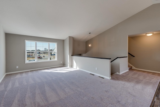 625 47th Ave NE, Saint Cloud, MN 56304 - unfurnished room with vaulted ceiling, carpet flooring, and stairs