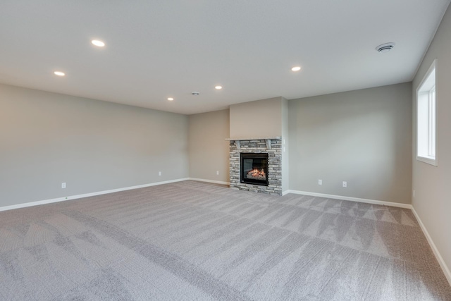 625 47th Ave NE, Saint Cloud, MN 56304 - unfurnished living room featuring carpet flooring, recessed lighting, and a stone fireplace