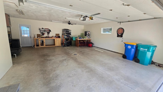 1515 3rd Ave NE, Owatonna, MN 55060 - garage with a garage door opener and a workshop area