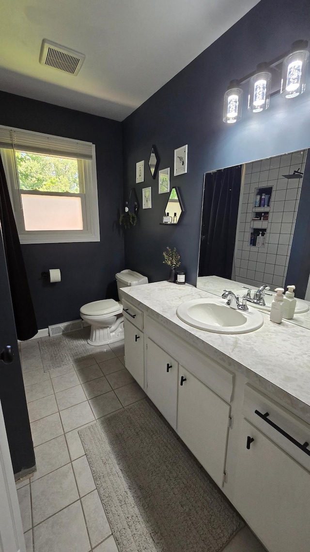 1515 3rd Ave NE, Owatonna, MN 55060 - bathroom with vanity and tile patterned flooring