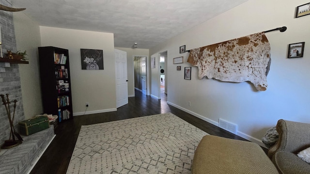 1515 3rd Ave NE, Owatonna, MN 55060 - hallway featuring dark wood-style floors and baseboards