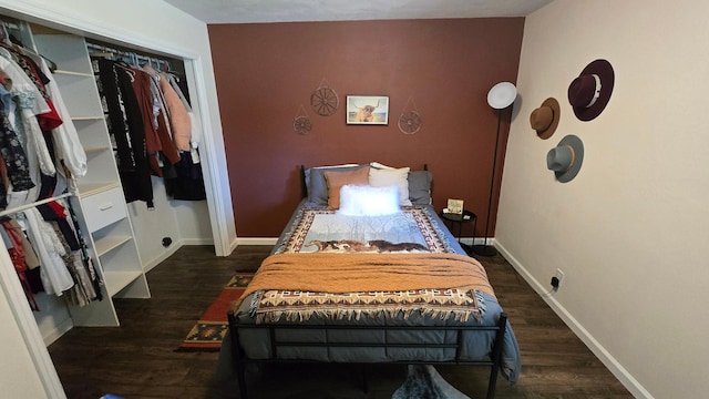 1515 3rd Ave NE, Owatonna, MN 55060 - bedroom featuring dark wood-style floors and an accent wall