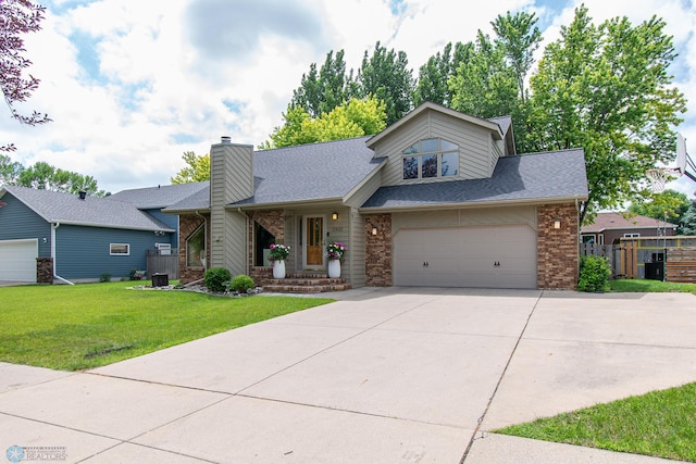 2902 24th Ave S, Fargo, ND 58103 - mid-century modern home with driveway, a shingled roof, brick siding, and a chimney