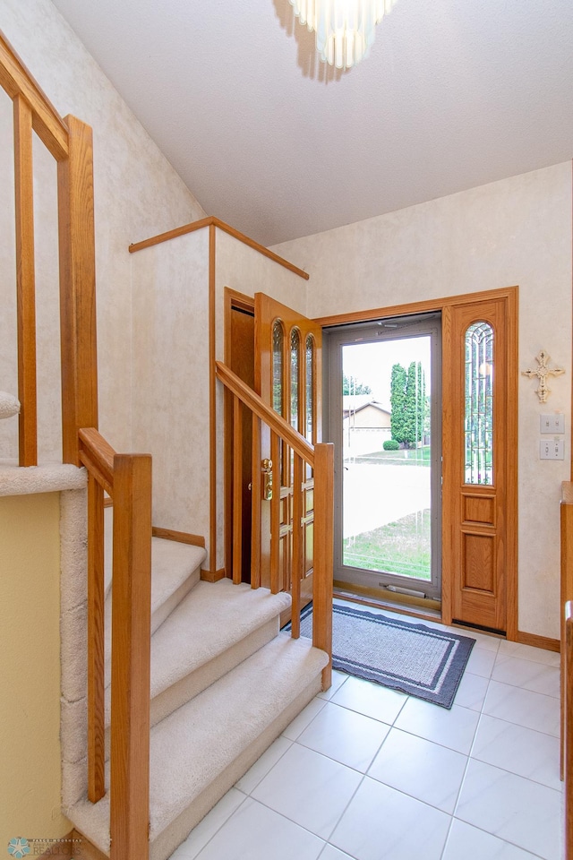 2902 24th Ave S, Fargo, ND 58103 - entryway featuring stairway, a chandelier, and tile patterned flooring