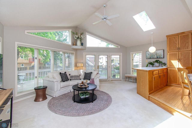2902 24th Ave S, Fargo, ND 58103 - living area with a skylight, ceiling fan, light colored carpet, and high vaulted ceiling
