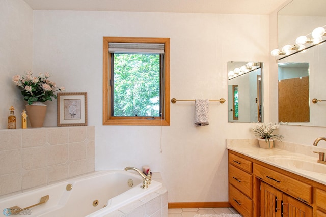 2902 24th Ave S, Fargo, ND 58103 - bathroom with vanity, a tub with jets, and tile patterned flooring