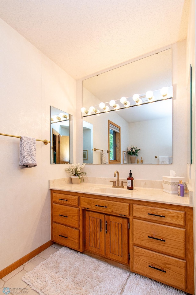 2902 24th Ave S, Fargo, ND 58103 - bathroom featuring vanity and tile patterned flooring