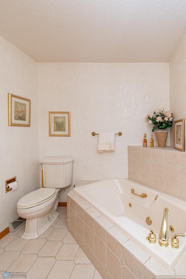 2902 24th Ave S, Fargo, ND 58103 - full bathroom featuring a jetted tub, a textured ceiling, and tile patterned flooring