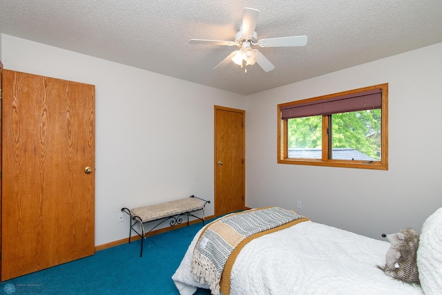 2902 24th Ave S, Fargo, ND 58103 - carpeted bedroom featuring a textured ceiling and ceiling fan