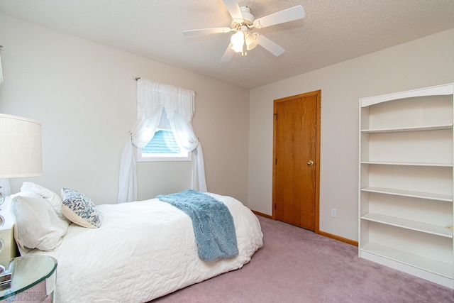 2902 24th Ave S, Fargo, ND 58103 - carpeted bedroom with a ceiling fan and baseboards