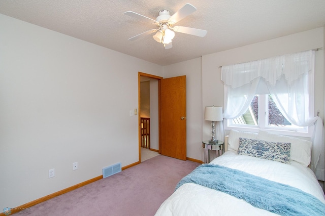 2902 24th Ave S, Fargo, ND 58103 - carpeted bedroom with a ceiling fan and a textured ceiling