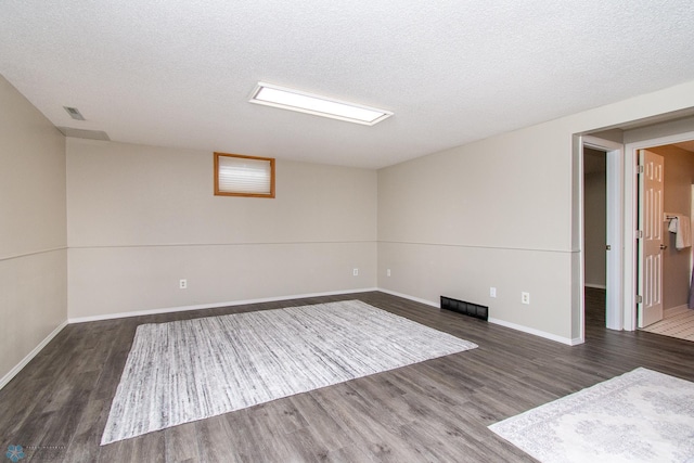 2902 24th Ave S, Fargo, ND 58103 - empty room featuring wood finished floors and a textured ceiling