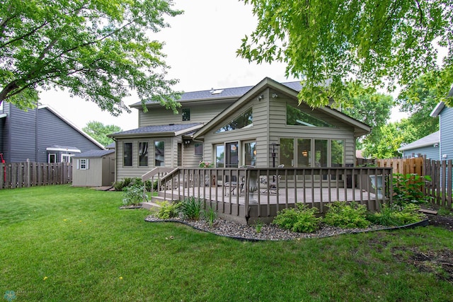 2902 24th Ave S, Fargo, ND 58103 - back of property with a storage unit, a fenced backyard, and a deck