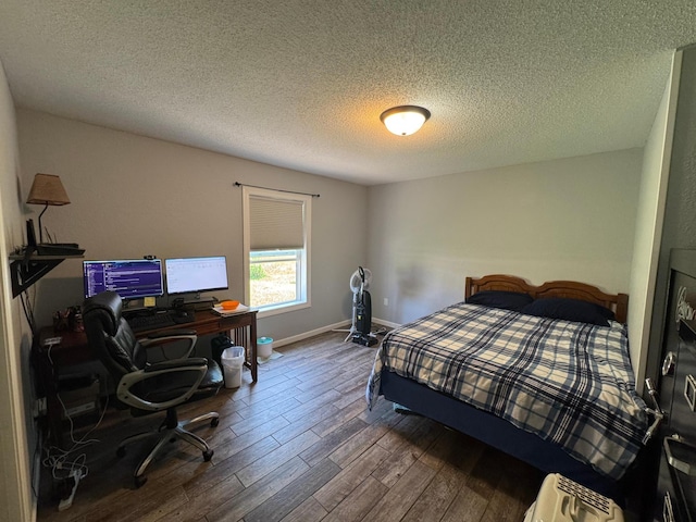 46313 St Lawrence Dr, Otto Twp, MN 56573 - bedroom featuring wood finished floors, a textured ceiling, and an office area