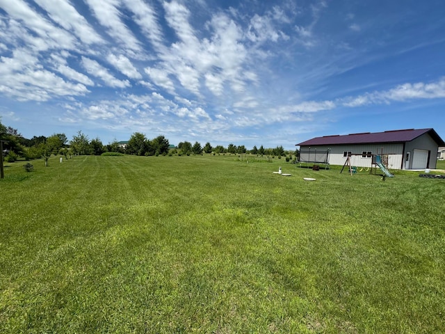 46313 St Lawrence Dr, Otto Twp, MN 56573 - view of green lawn with a garage
