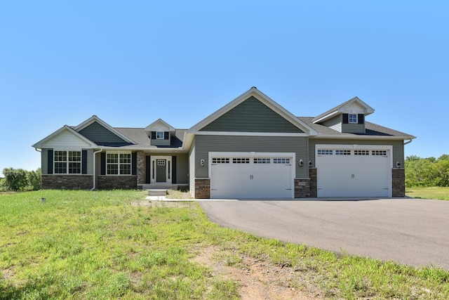 11039 285th Ave, Zimmerman, MN 55398 - craftsman inspired home featuring an attached garage, asphalt driveway, a front yard, and stone siding