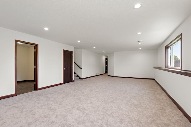 11039 285th Ave, Zimmerman, MN 55398 - unfurnished room featuring light carpet, recessed lighting, and stairway