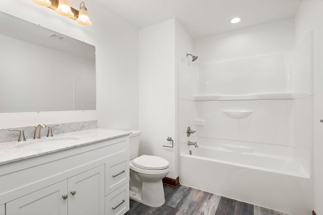 11039 285th Ave, Zimmerman, MN 55398 - bathroom with wood finished floors, vanity, bathtub / shower combination, and recessed lighting
