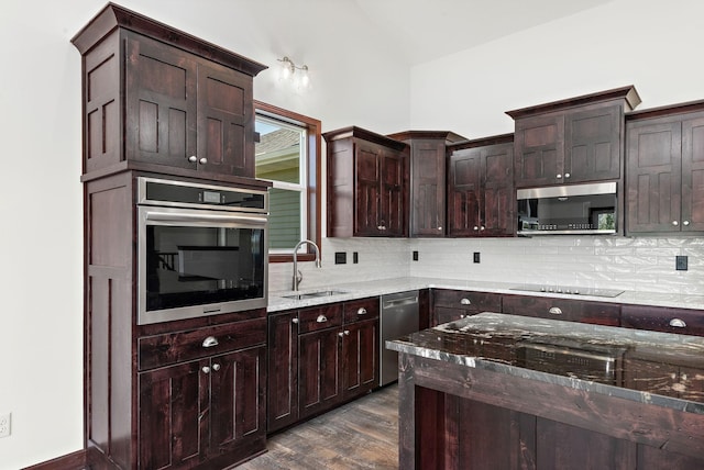 11039 285th Ave, Zimmerman, MN 55398 - kitchen with stainless steel appliances, light stone counters, backsplash, dark wood-type flooring, and dark brown cabinets