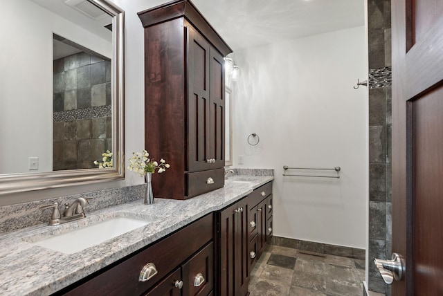 11039 285th Ave, Zimmerman, MN 55398 - bathroom featuring stone tile flooring and double vanity