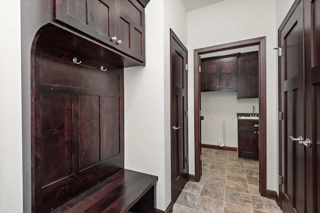 11039 285th Ave, Zimmerman, MN 55398 - mudroom with baseboards and light stone finish floors