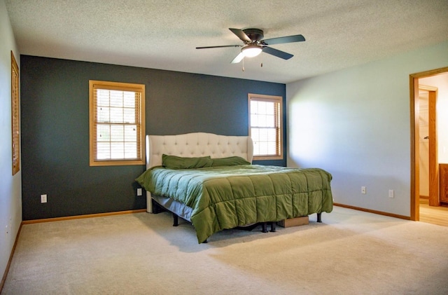 66182 310th Ave, Lake City, MN 55041 - bedroom with carpet floors, a textured ceiling, and a ceiling fan