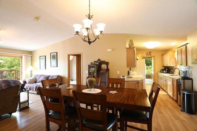 410 Pospeck Ln, Hoyt Lakes, MN 55750 - dining space featuring light wood-style floors, healthy amount of natural light, and a chandelier