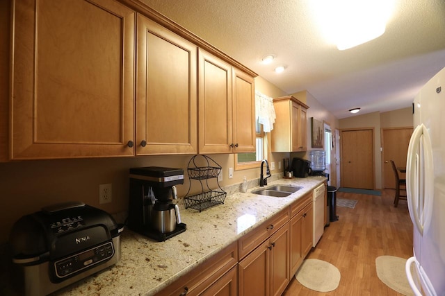 410 Pospeck Ln, Hoyt Lakes, MN 55750 - kitchen featuring white appliances, light wood-type flooring, lofted ceiling, and light stone countertops