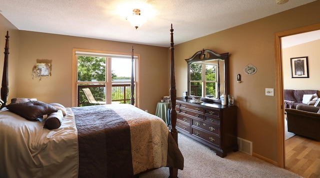 410 Pospeck Ln, Hoyt Lakes, MN 55750 - bedroom with multiple windows and light colored carpet