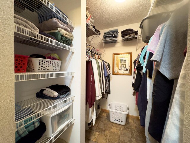 410 Pospeck Ln, Hoyt Lakes, MN 55750 - walk in closet featuring stone finish flooring