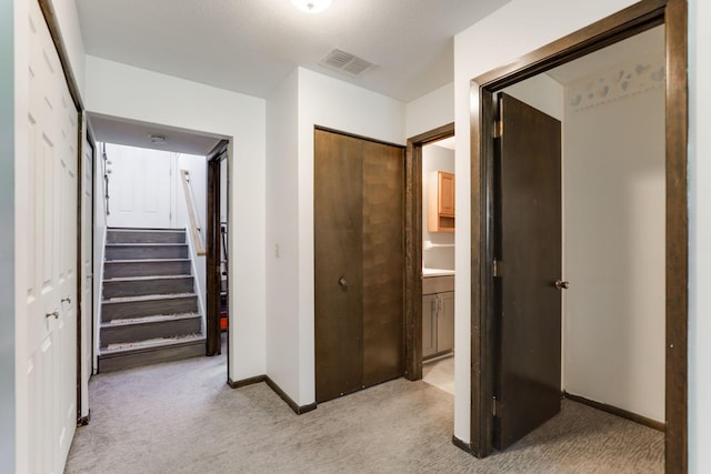12190 Drake St NW, Coon Rapids, MN 55448 - hall with light colored carpet and stairs
