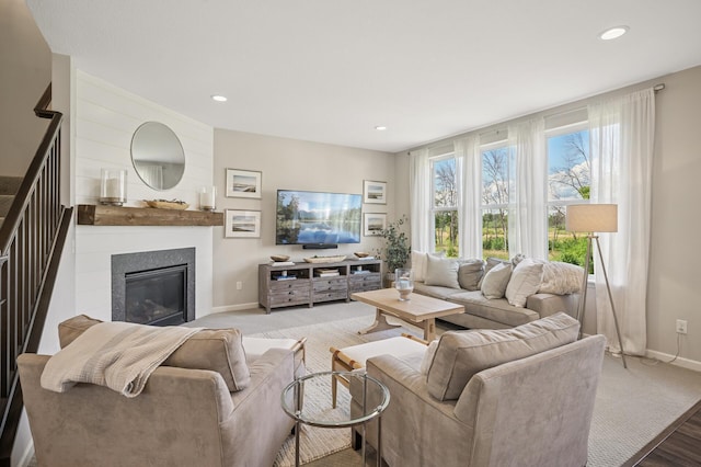 3702 112th Cir NE, Blaine, MN 55449 - living area with a glass covered fireplace, recessed lighting, carpet flooring, and stairway