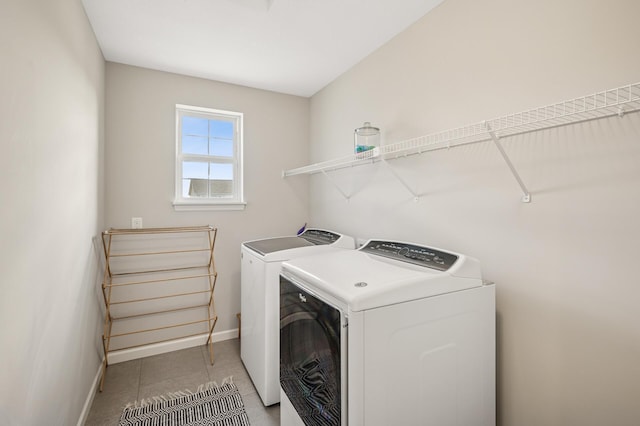 3702 112th Cir NE, Blaine, MN 55449 - washroom with washing machine and clothes dryer and light tile patterned flooring