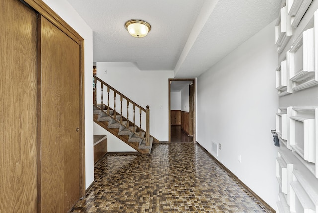 6925 Colorado Ave N, Brooklyn Park, MN 55429 - foyer entrance with stairway and a textured ceiling