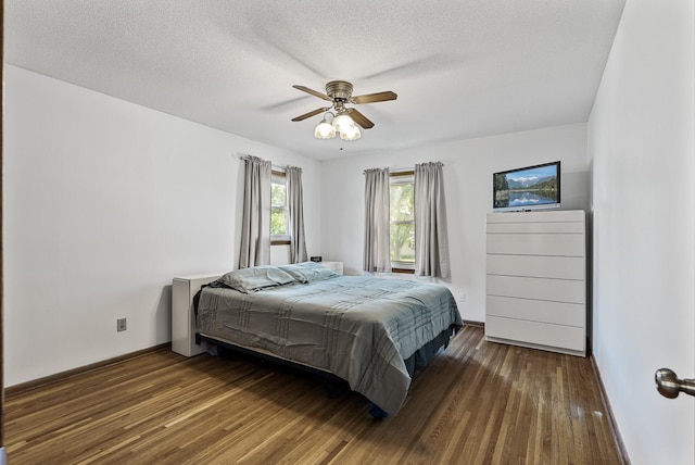 6925 Colorado Ave N, Brooklyn Park, MN 55429 - bedroom with wood finished floors, a textured ceiling, and a ceiling fan