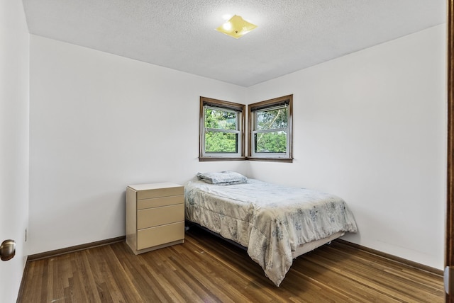 6925 Colorado Ave N, Brooklyn Park, MN 55429 - bedroom with wood finished floors and a textured ceiling