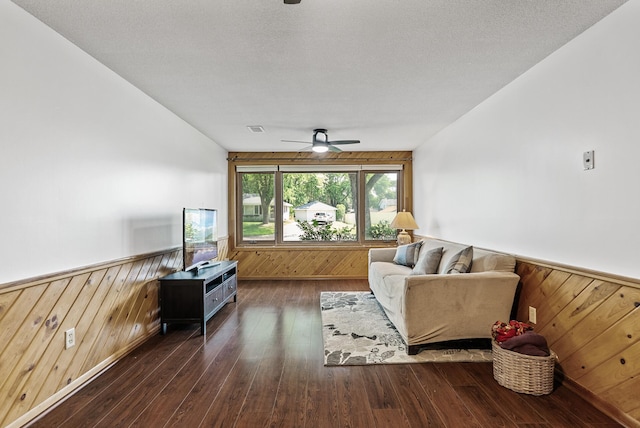 6925 Colorado Ave N, Brooklyn Park, MN 55429 - living room featuring a ceiling fan, wainscoting, wooden walls, and hardwood / wood-style flooring