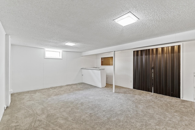 6925 Colorado Ave N, Brooklyn Park, MN 55429 - basement with a textured ceiling and carpet floors